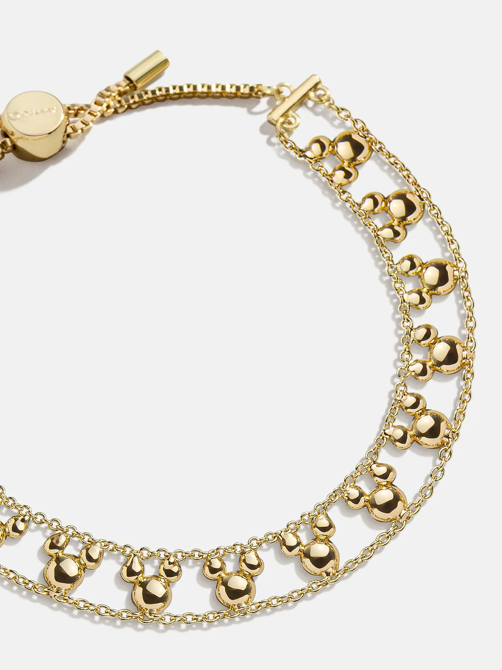 Disney Mickey Mouse Repeating Slider Bracelet - Gold sold by BaubleBar