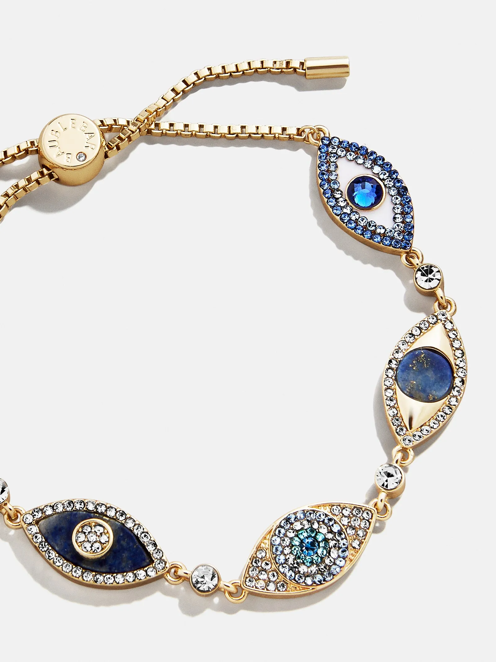 Ojo Bracelet - Gold/Blue sold by BaubleBar