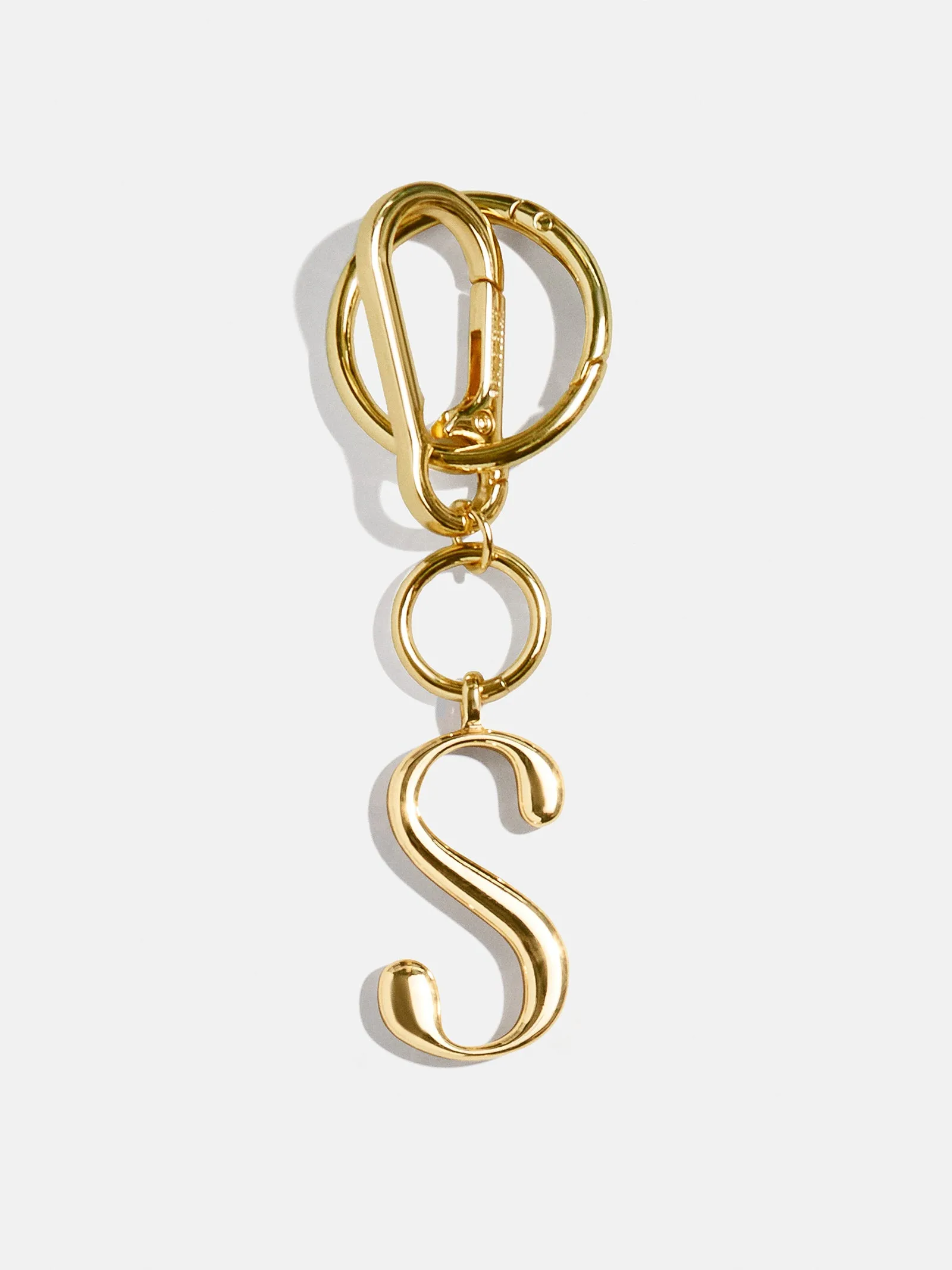 Gold Initial Enamel Bag Charm - S sold by BaubleBar