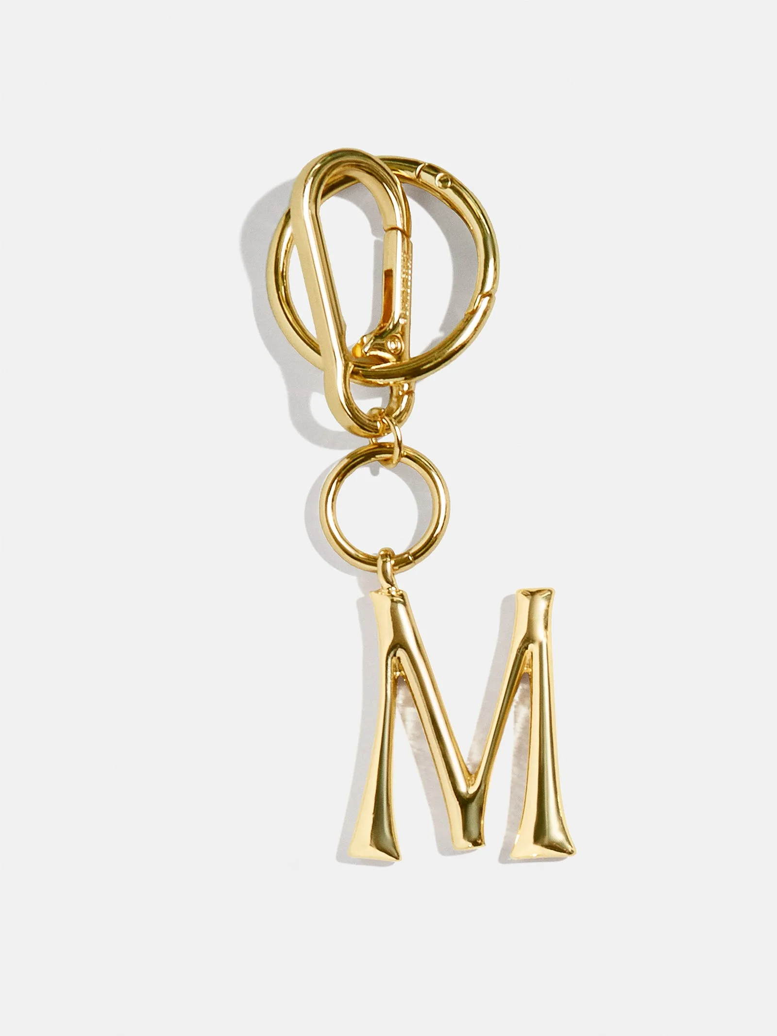 Gold Initial Enamel Bag Charm - M sold by BaubleBar