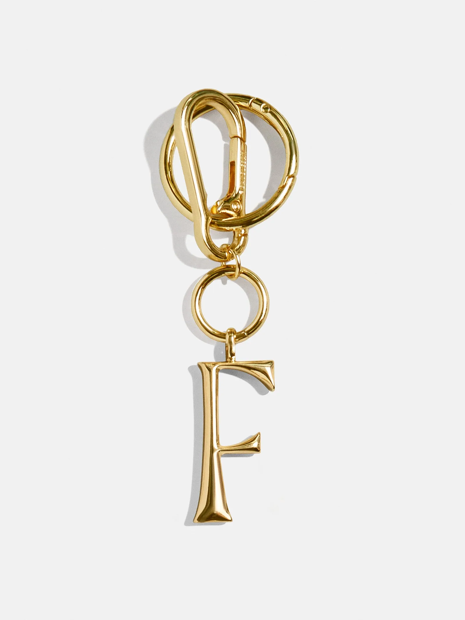 Gold Initial Enamel Bag Charm - F sold by BaubleBar