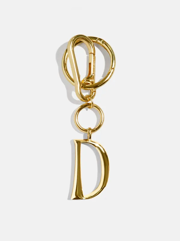 Gold Initial Enamel Bag Charm - D sold by BaubleBar