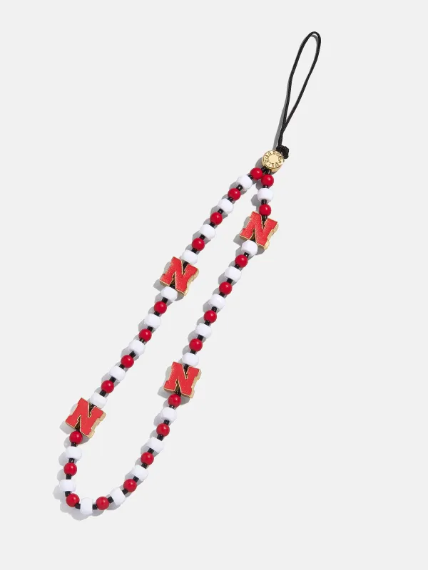 University of Nebraska Beaded Phone Charm - University of Nebraska sold by BaubleBar