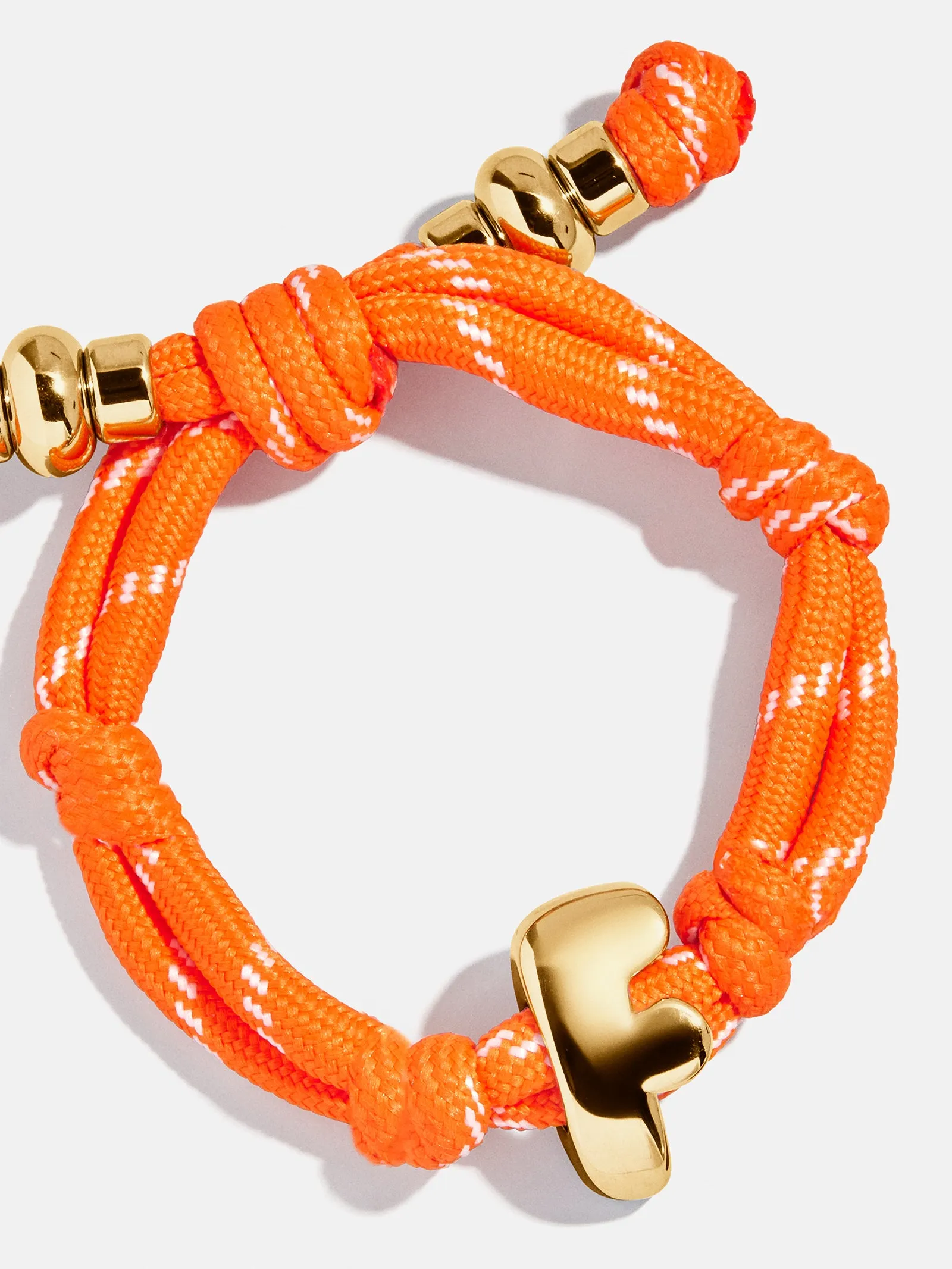 Knotty Initial Custom Bracelet - Tangerine Single Letter sold by BaubleBar