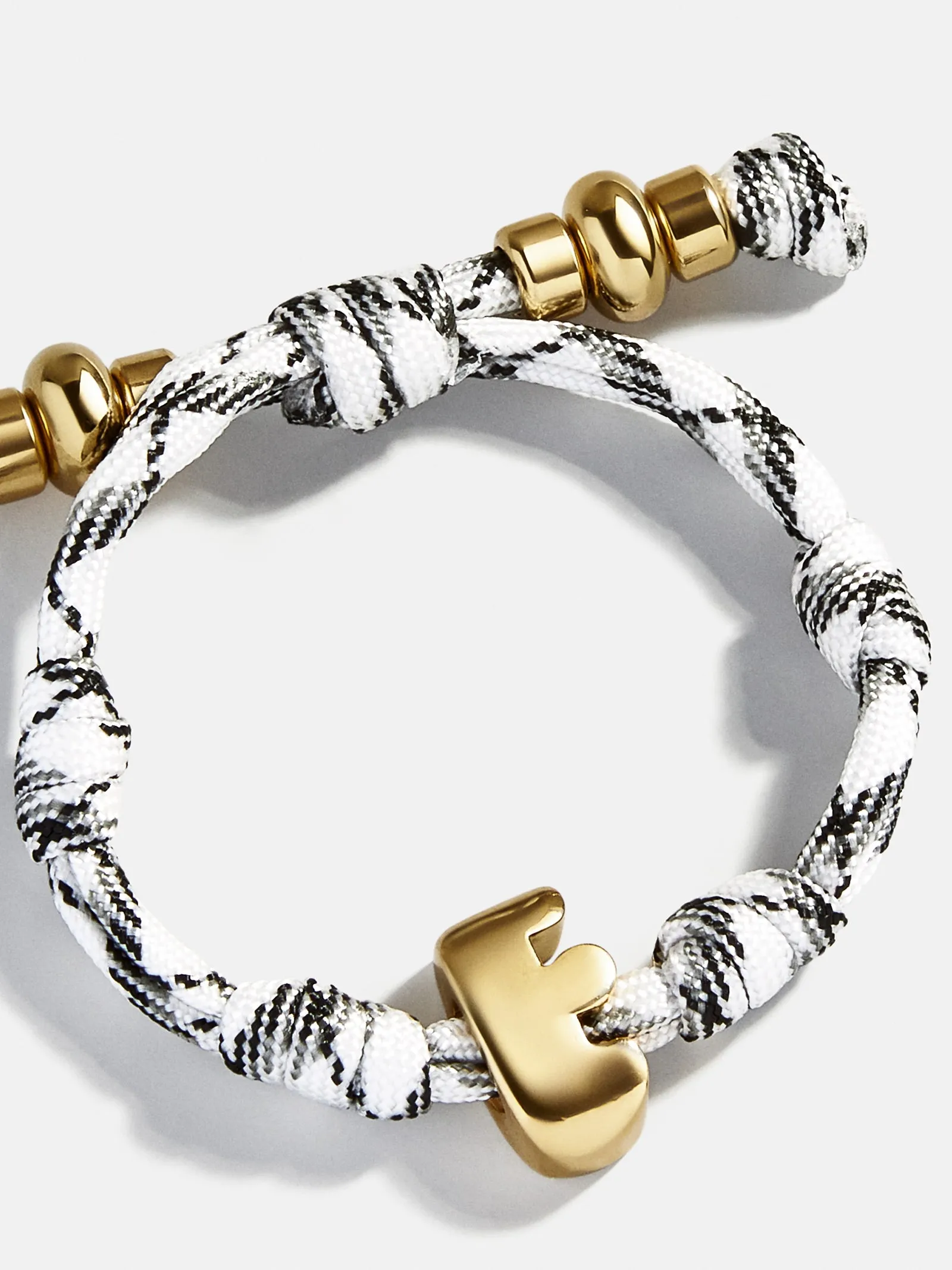 Knotty Initial Custom Bracelet - Onyx/White Single Letter sold by BaubleBar