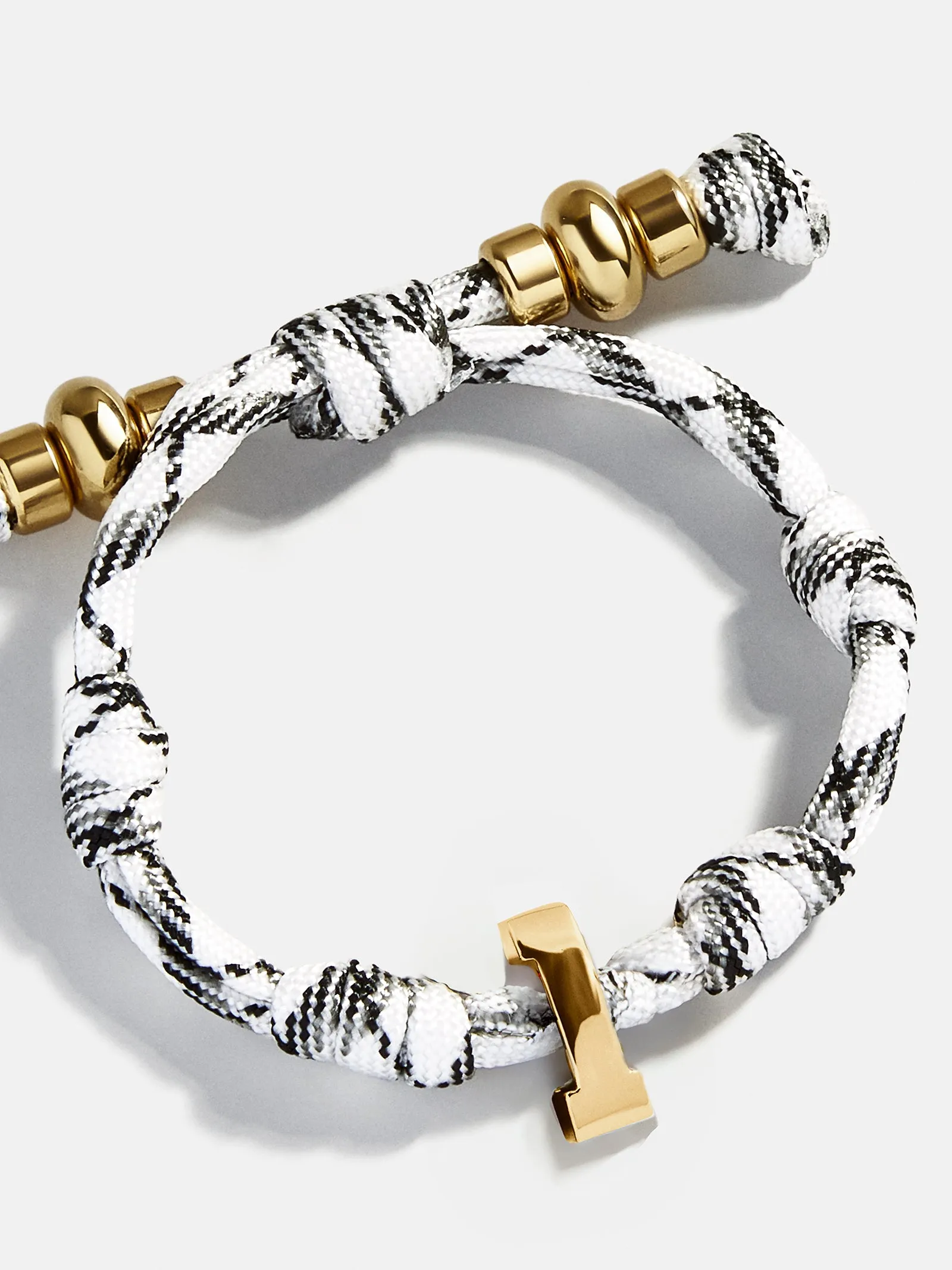 Knotty Varsity Number Custom Bracelet - Onyx/White Single Digit sold by BaubleBar