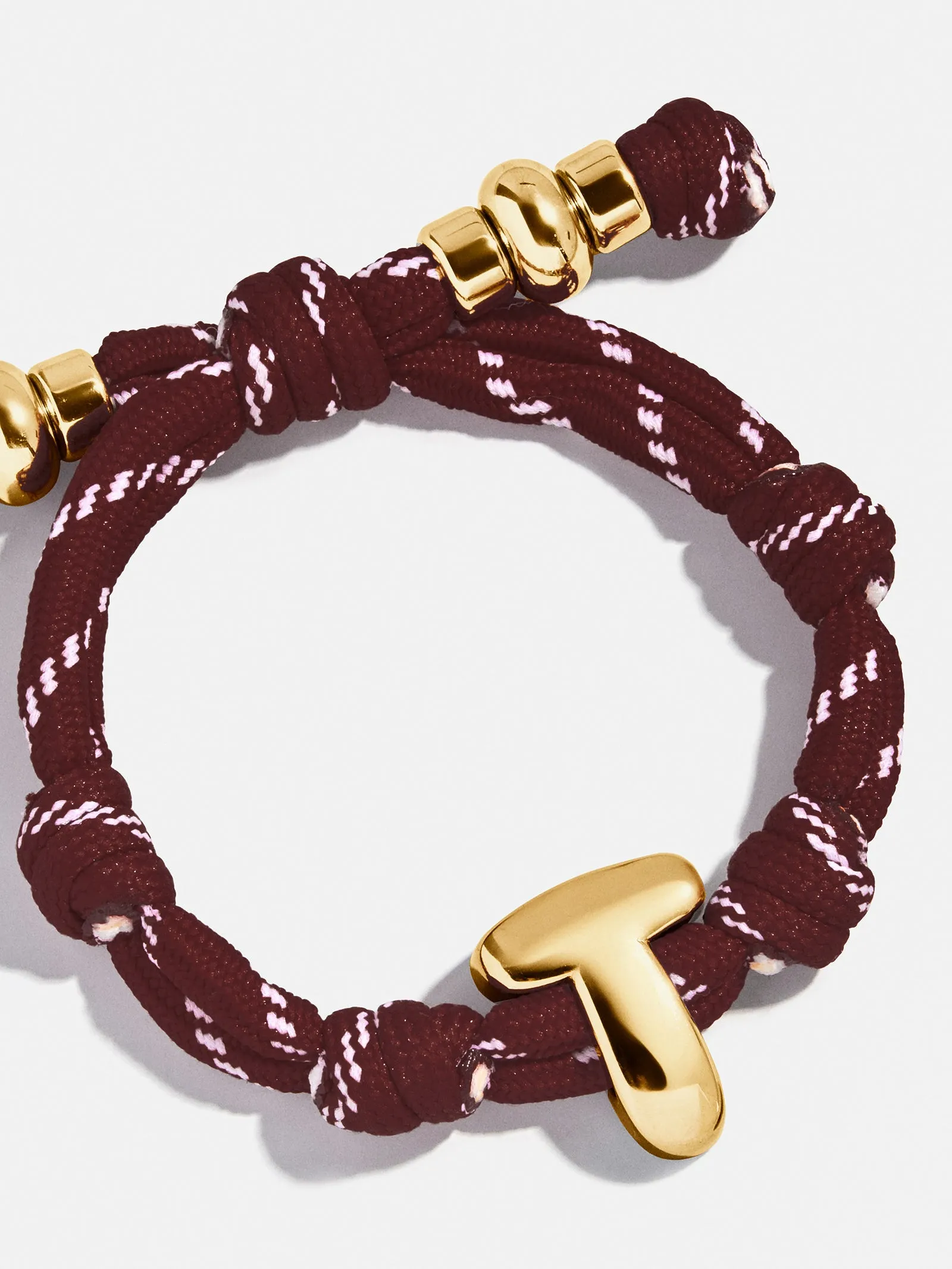 Knotty Initial Custom Bracelet - Maroon Single Letter sold by BaubleBar