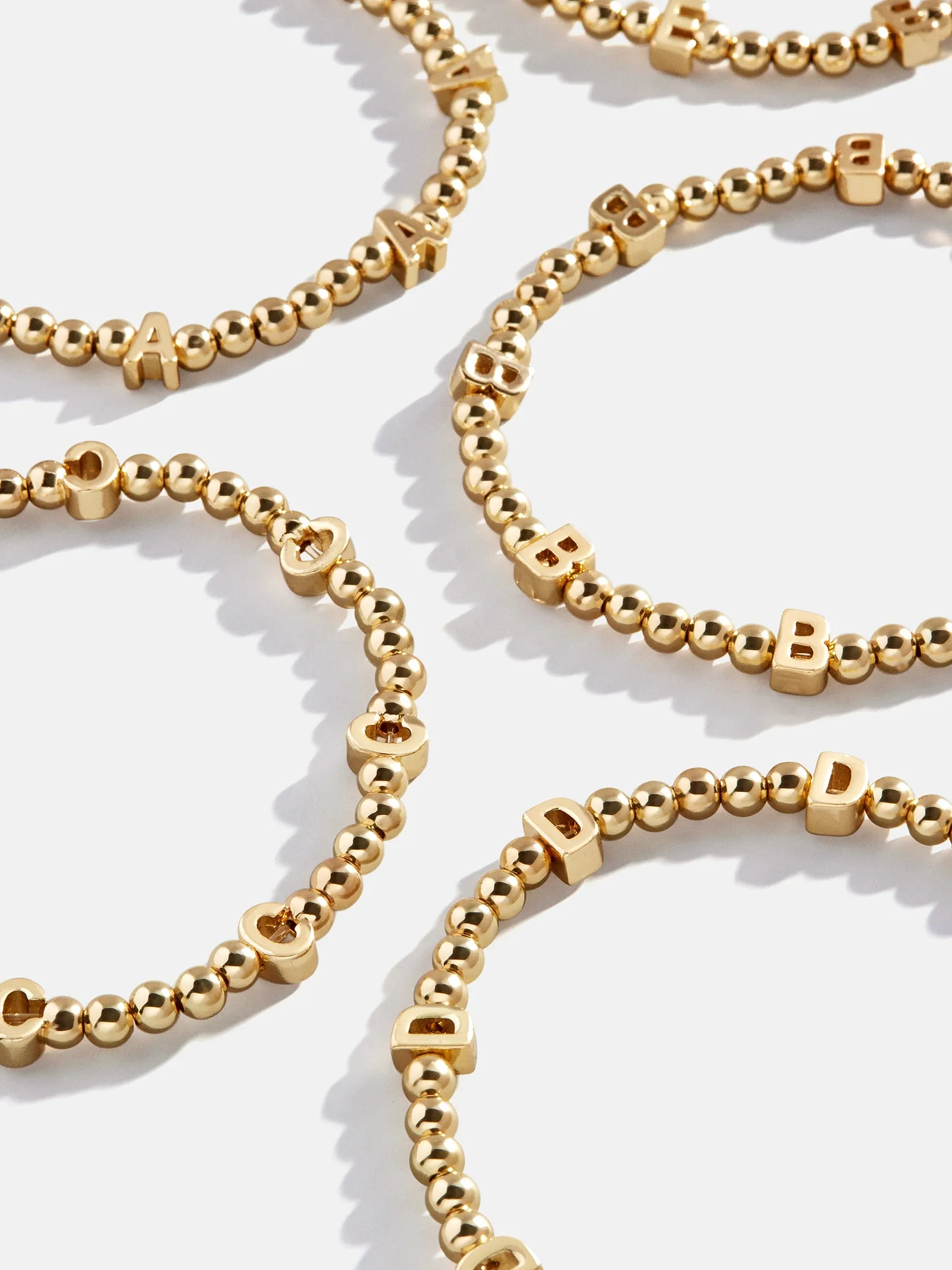 Repeating Initial Pisa Bracelet - Gold sold by BaubleBar