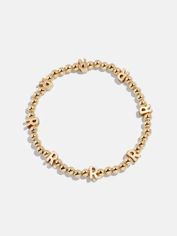 Gold Repeating Initial Pisa Bracelet - R sold by BaubleBar
