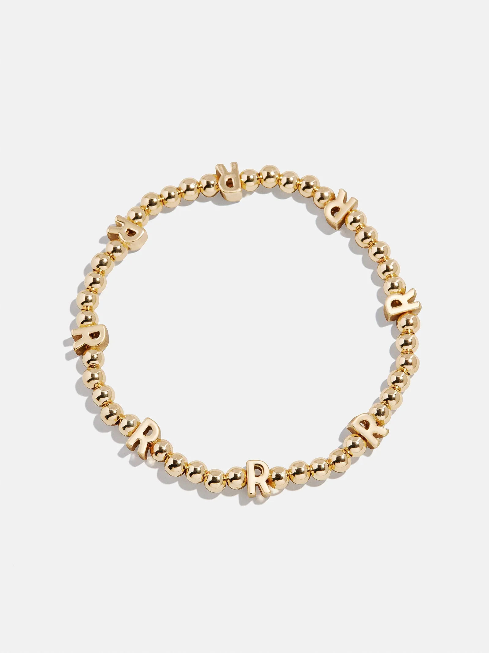 Gold Repeating Initial Pisa Bracelet - R sold by BaubleBar