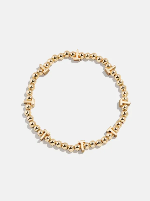 Gold Repeating Initial Pisa Bracelet - T sold by BaubleBar