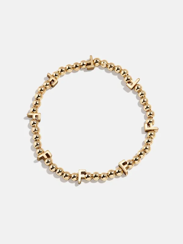 Gold Repeating Initial Pisa Bracelet - F sold by BaubleBar