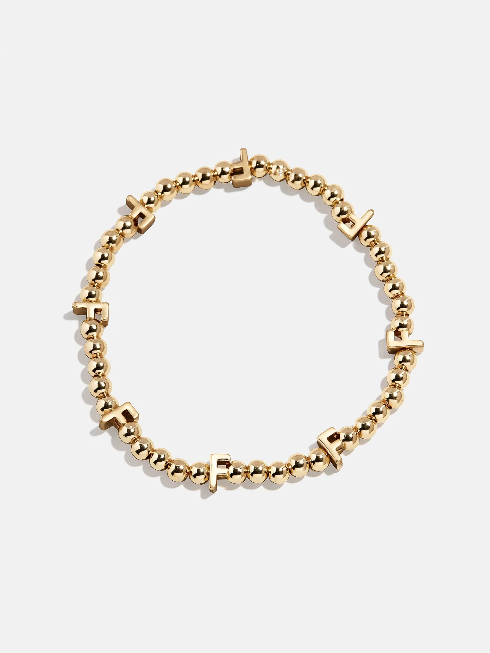 Gold Repeating Initial Pisa Bracelet - F sold by BaubleBar