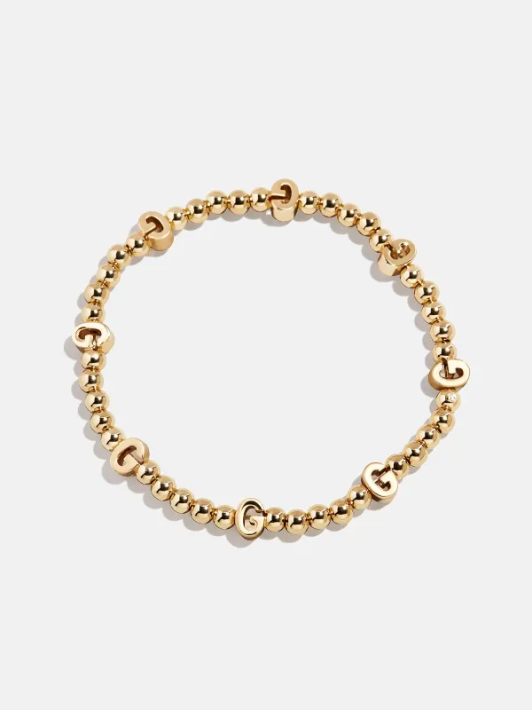 Gold Repeating Initial Pisa Bracelet - G sold by BaubleBar