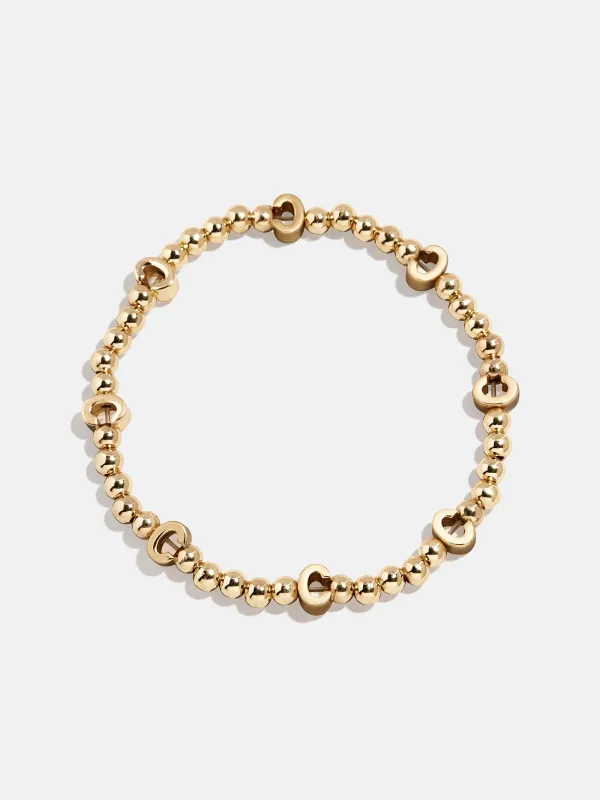 Gold Repeating Initial Pisa Bracelet - C sold by BaubleBar