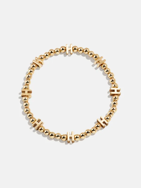 Gold Repeating Initial Pisa Bracelet - H sold by BaubleBar
