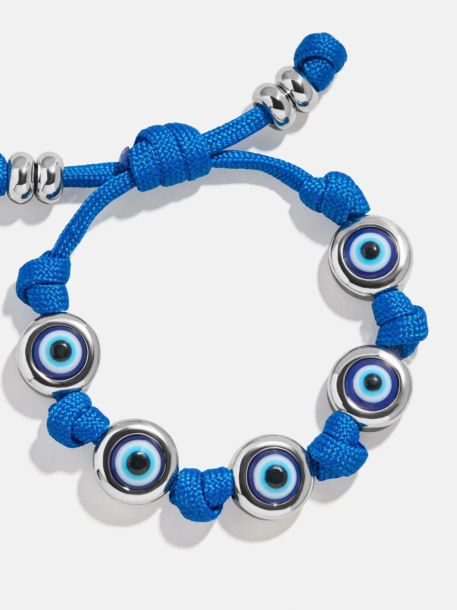 Eyes Open Evil Eye Paracord Bracelet - Blue sold by BaubleBar