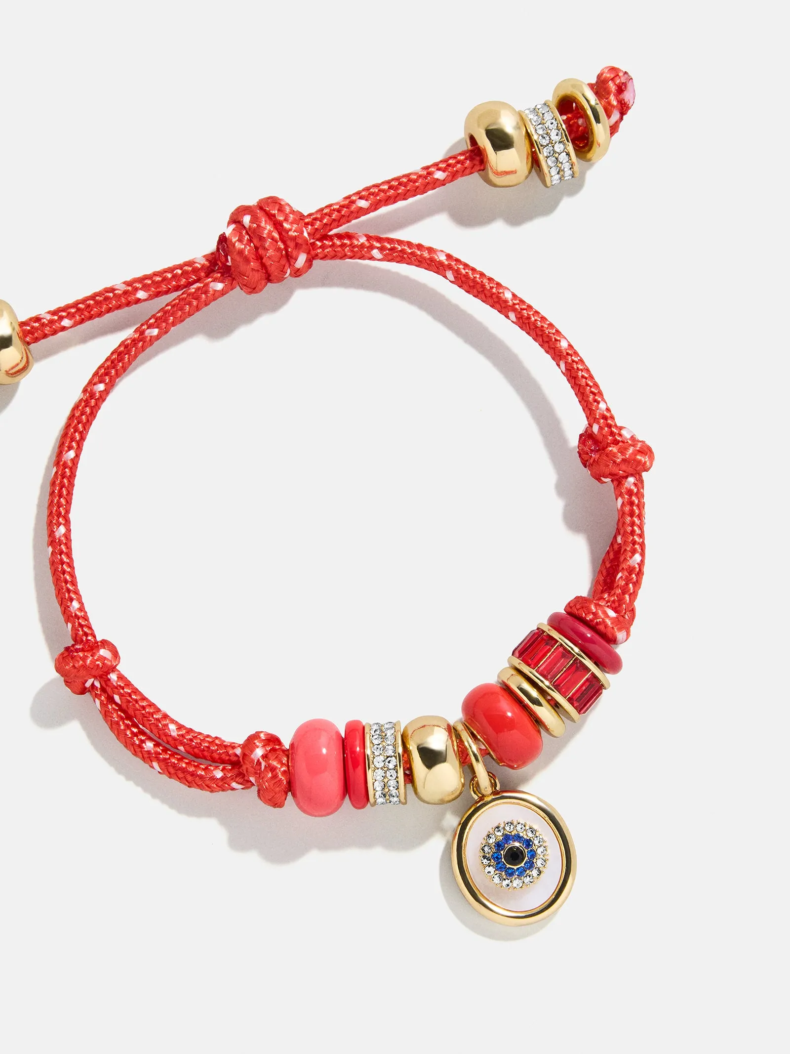 Eye Candy Evil Eye Paracord Bracelet - Red sold by BaubleBar