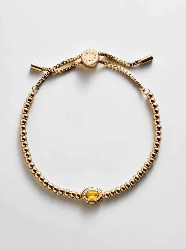 Bezel Birthstone Pisa Bracelet - Topaz made by BaubleBar