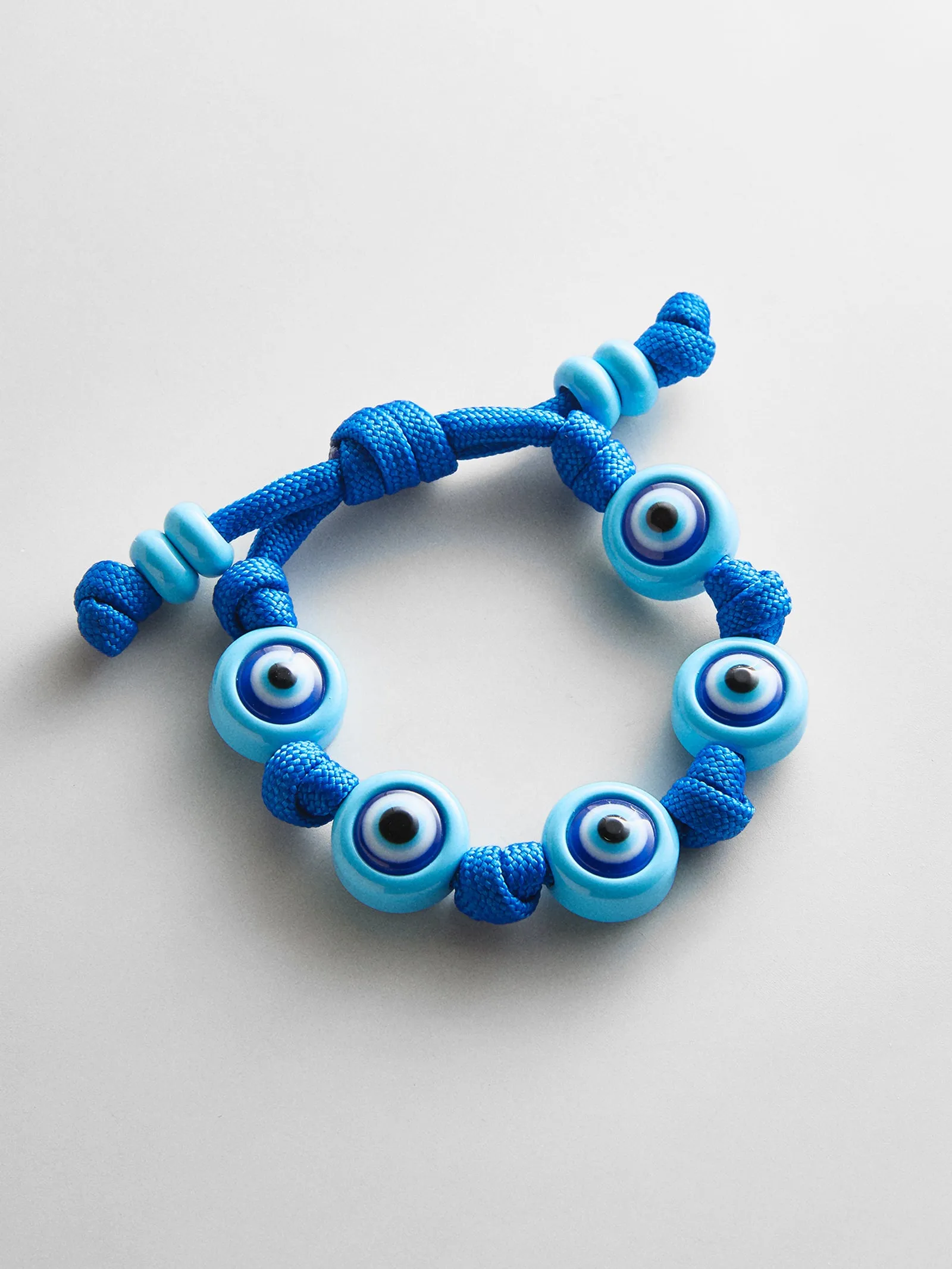 Knotty Good Eye Cord Bracelet - Aqua sold by BaubleBar