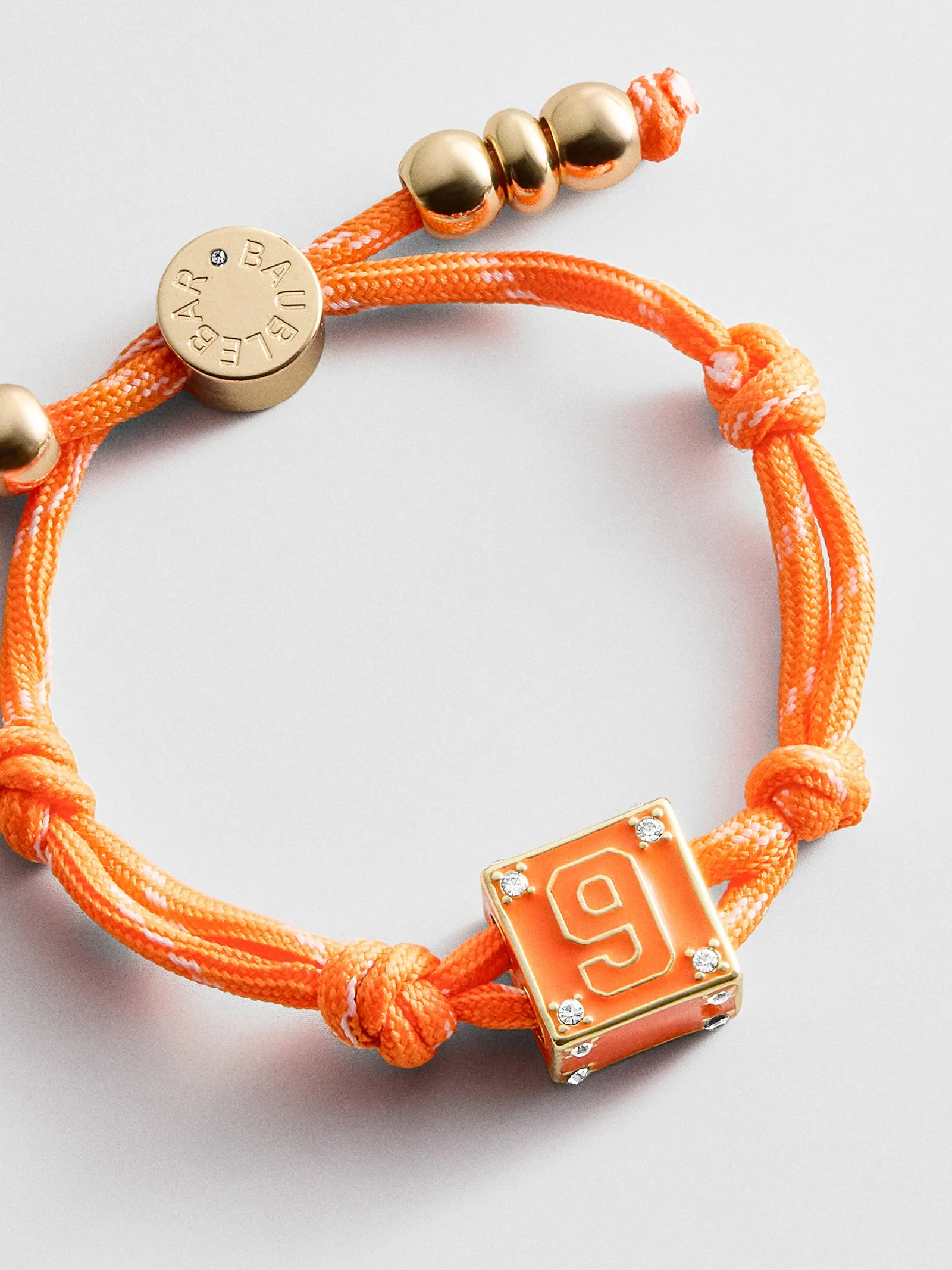 Block Party Varsity Number Custom Bracelet - Tangerine Single Digit sold by BaubleBar product image thumbnail 3
