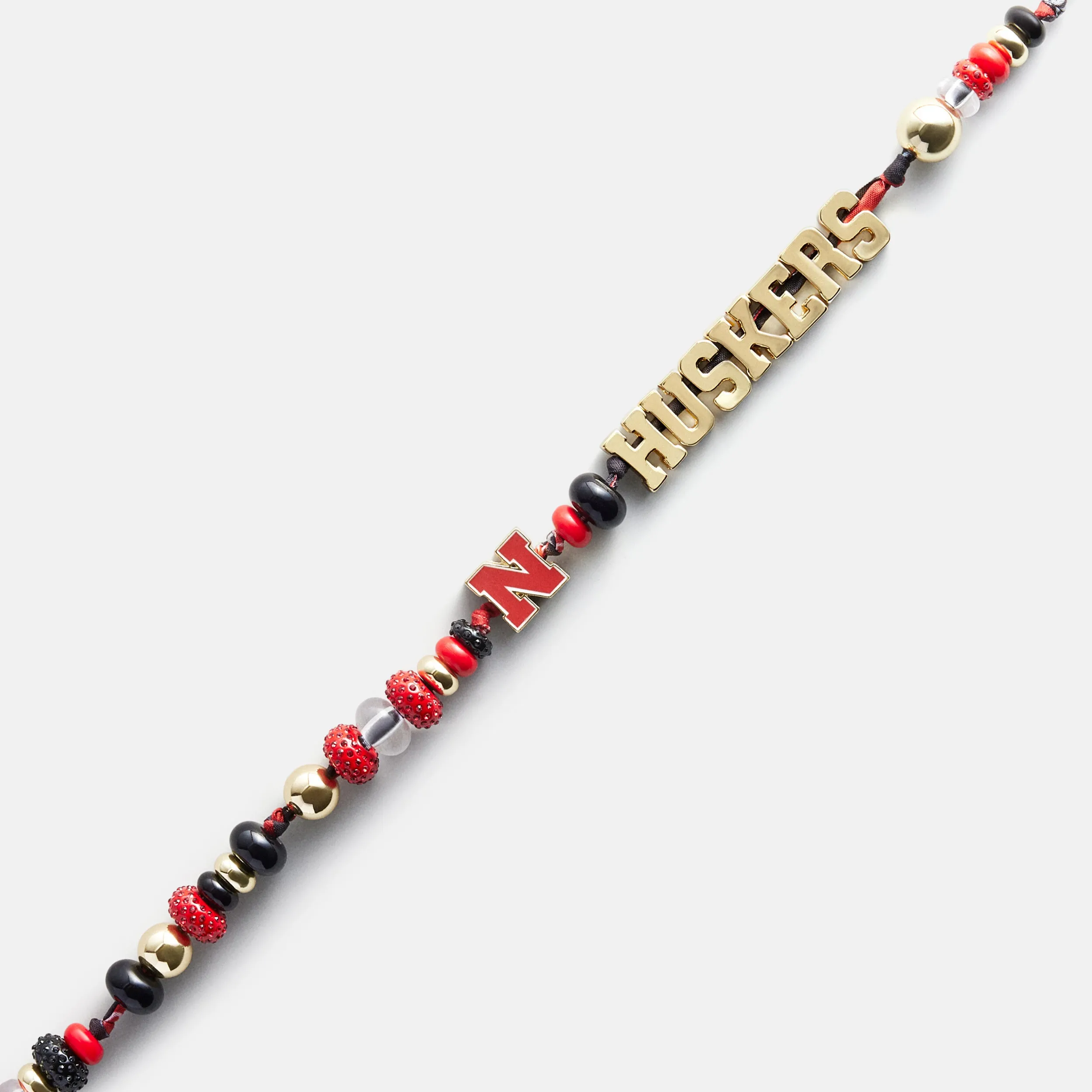 University of Nebraska Beaded Bandana Phone Charm - University of Nebraska sold by BaubleBar product image thumbnail 4