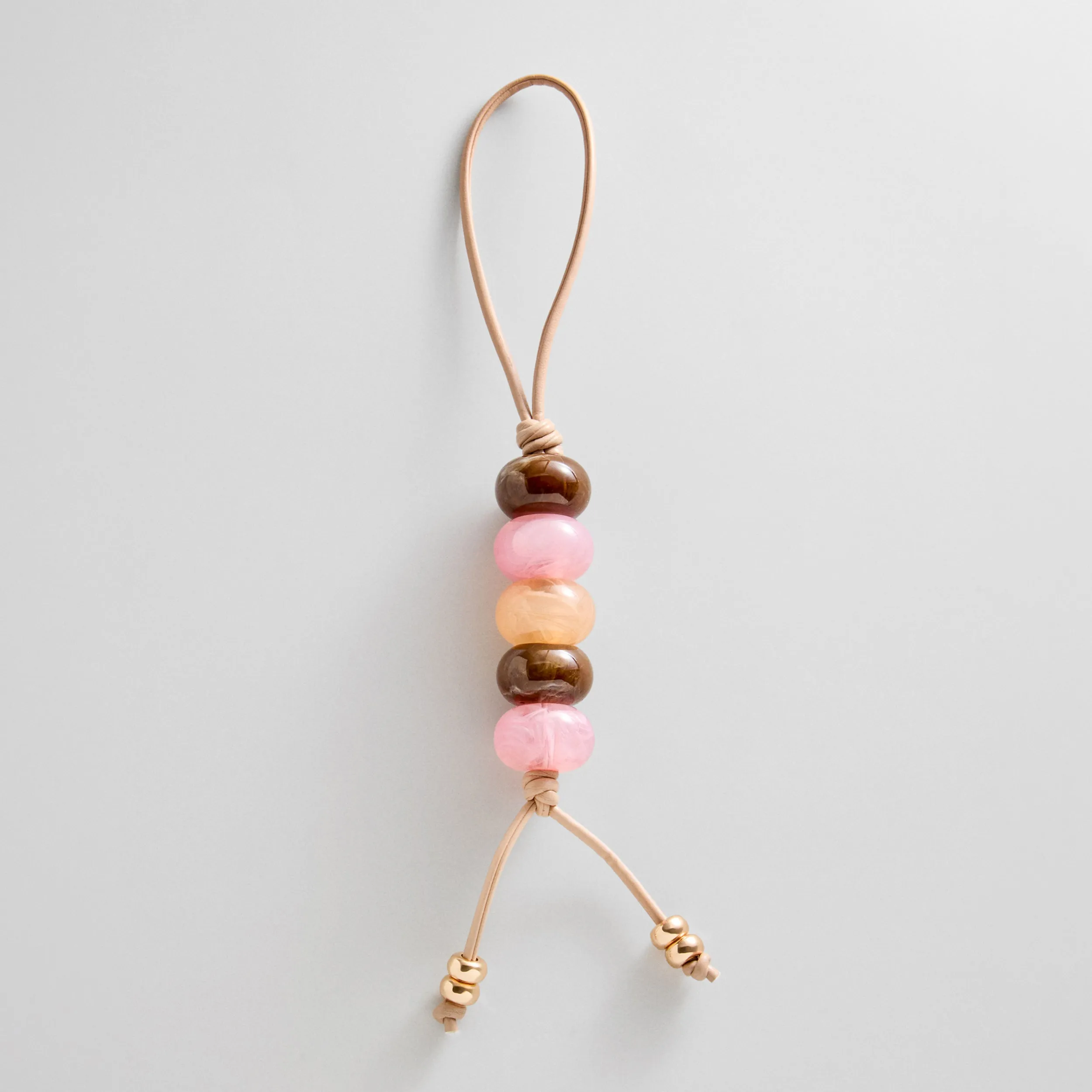 Bead My Guest Bag Charm sold by BaubleBar