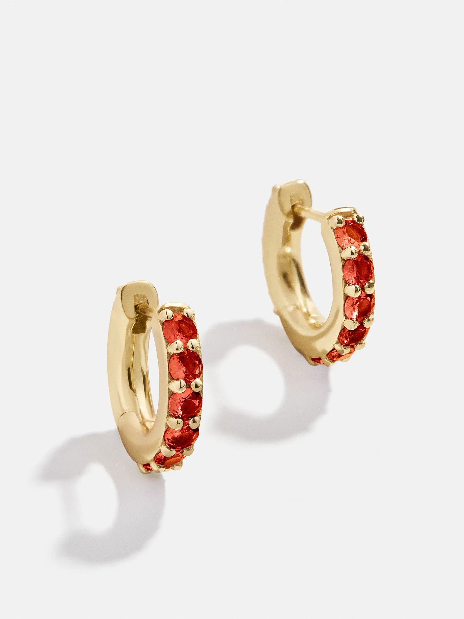 18K Gold Birthstone Huggie Earrings - Garnet sold by BaubleBar