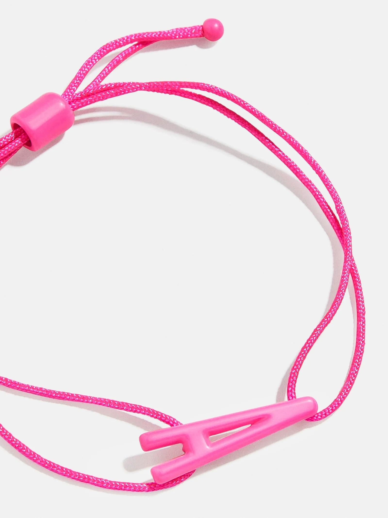 East West Initial Cord Bracelet - Hot Pink sold by BaubleBar
