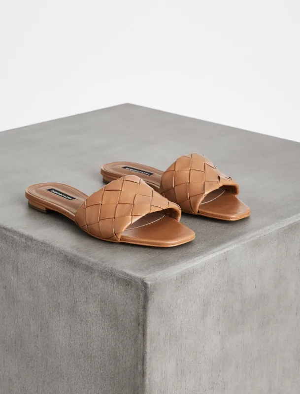 Remi Flat Slide sold by BCBGMaxAzria