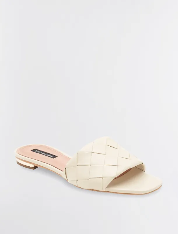 Remi Flat Slide sold by BCBGMaxAzria
