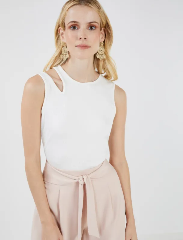 Asymmetrical Cutout Tank sold by BCBGMaxAzria