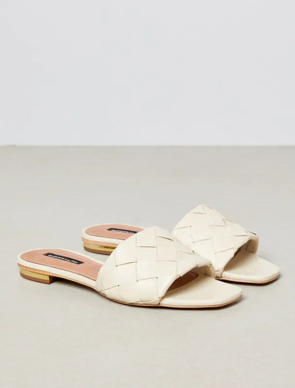 Remi Flat Slide sold by BCBGMaxAzria