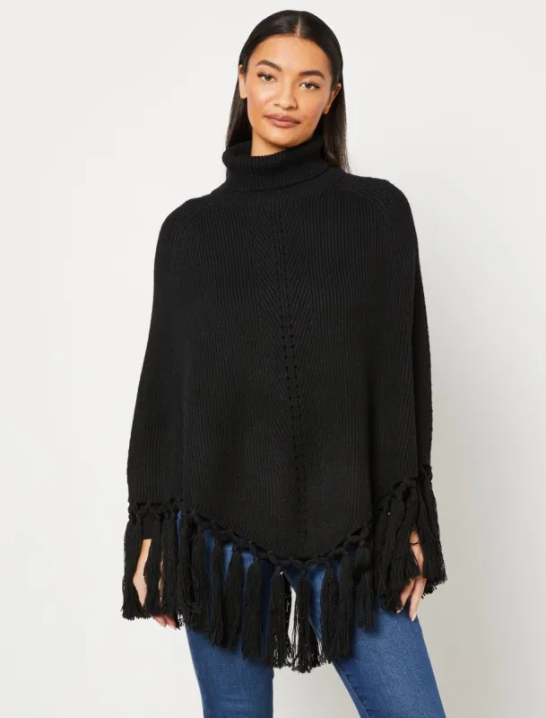 Turtleneck Fringe Cape sold by BCBGMaxAzria