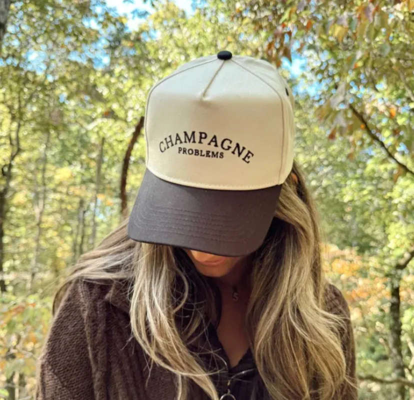 Champagne Problems - Black Vintage Trucker Hat sold by Beach Bunny
