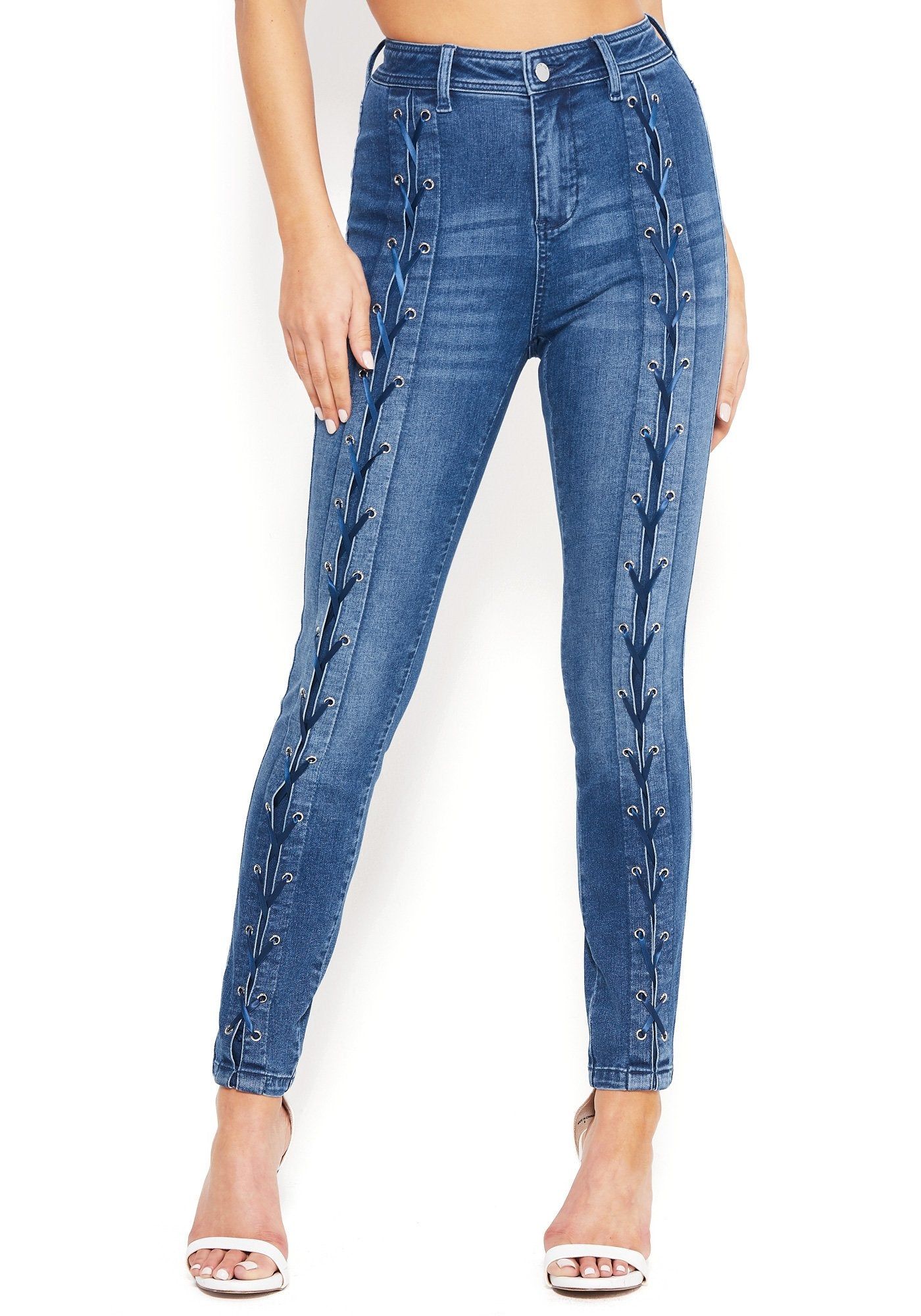 Lace-Up Skinny Jeans sold by Bebe