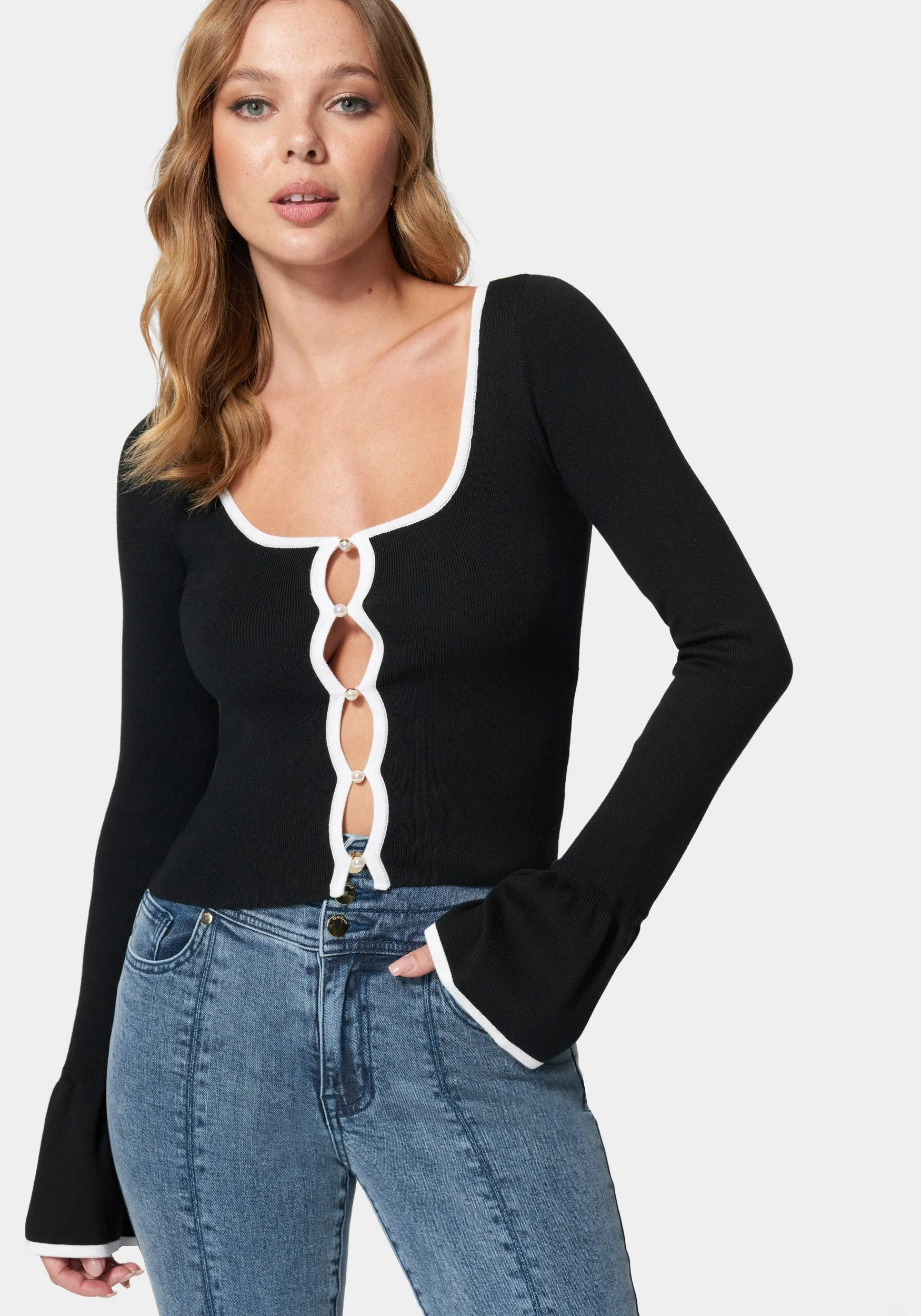 Button Front Ruffle Hem Sleeve Cardigan sold by Bebe