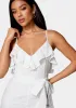 Eyelet Ruffle Romper sold by Bebe