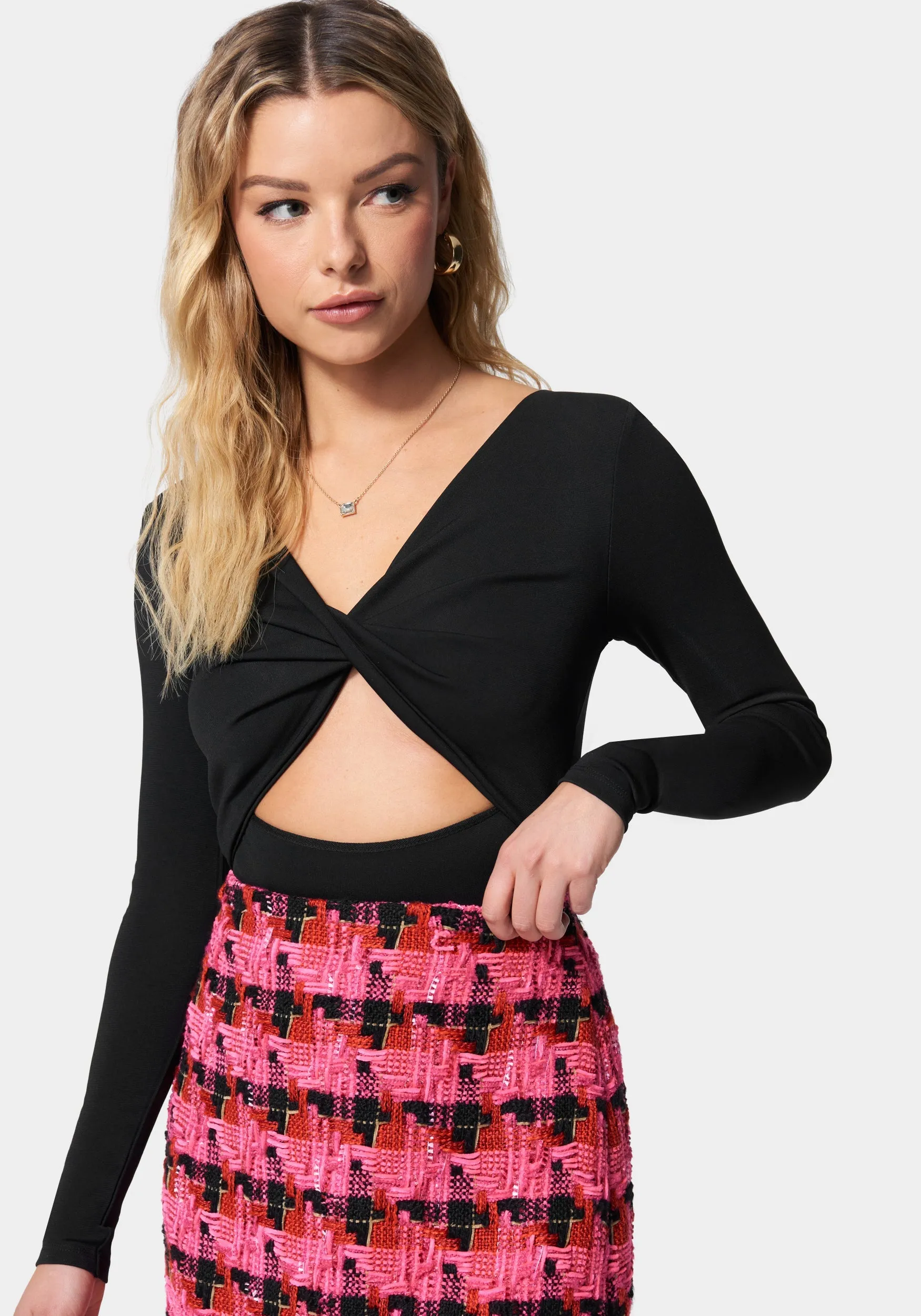 Twist Front Long Sleeve Bodysuit sold by Bebe