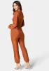 Sparkle Knit Long Sleeve Jumpsuit sold by Bebe