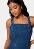 Multi Band Detail Denim Dress sold by Bebe