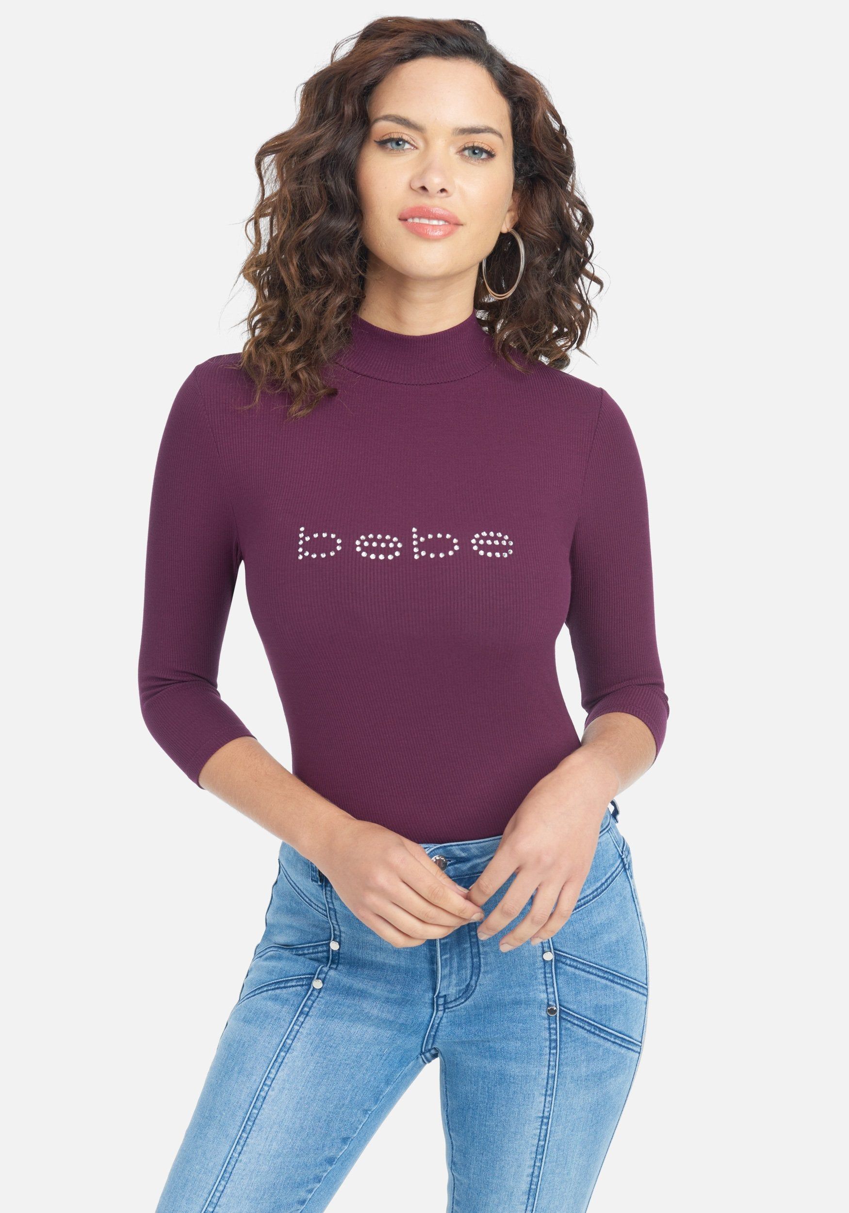 Crystal Logo Mock Neck 3/4 Sleeve Tee sold by Bebe
