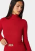 Fitted Turtle Neck Ornate Belt Sweater sold by Bebe