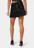 Mini Sequin Ruffle Slit Skort sold by Bebe