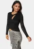 Lace Wrap Top sold by Bebe