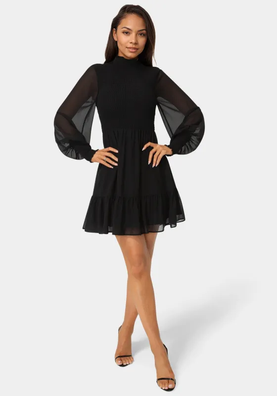 Long Sleeve Mock Neck Chifon Smocked Mini Dress sold by Bebe