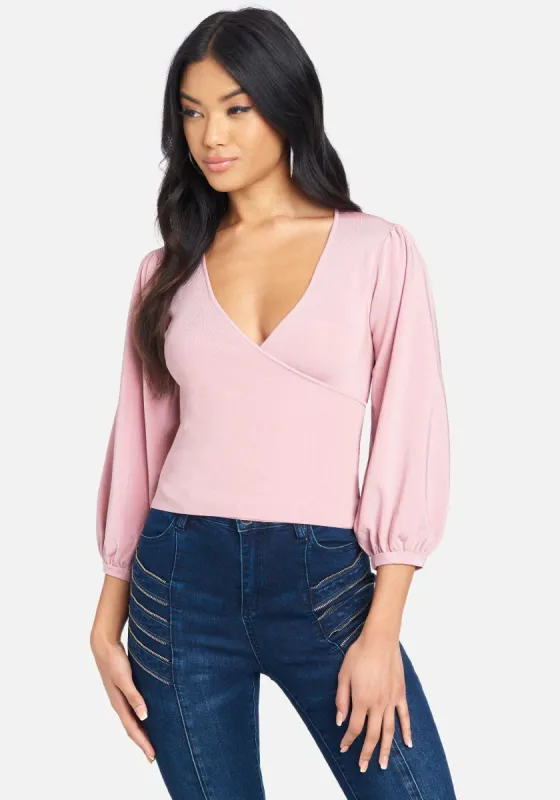 Surplice Wrap Around Sweater Top sold by Bebe