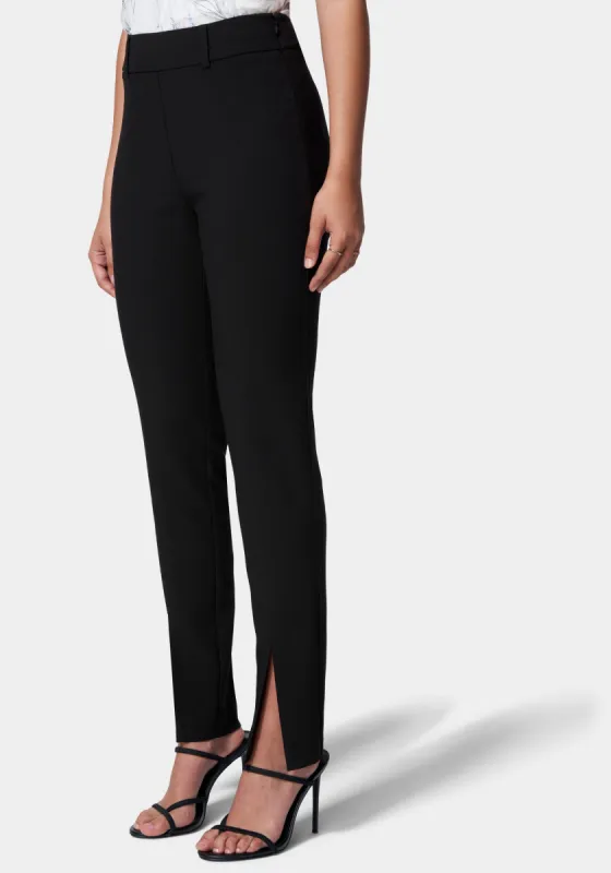 Front Slit Slim Leg Woven Pant sold by Bebe