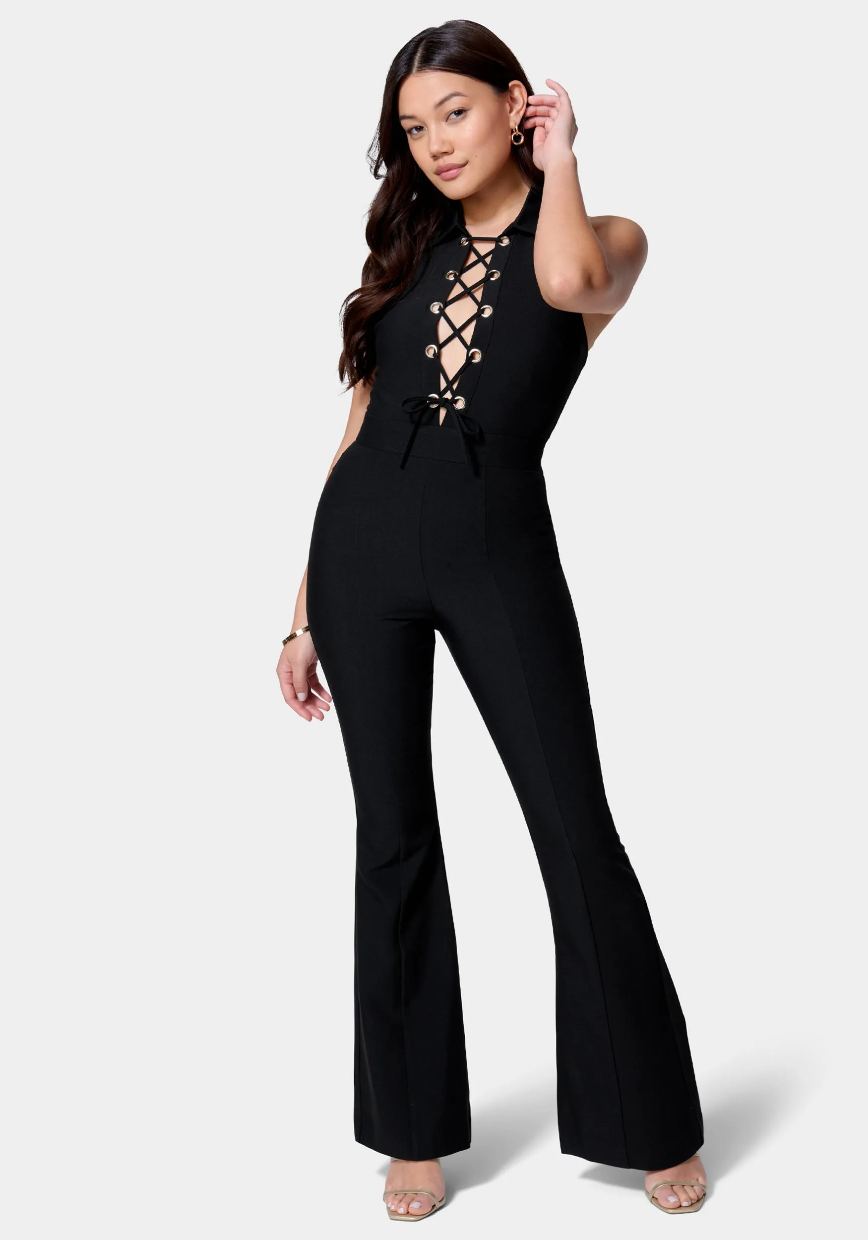 Satin Twill Sleeveless Eyelet Detail Wide Leg Jumpsuit sold by Bebe