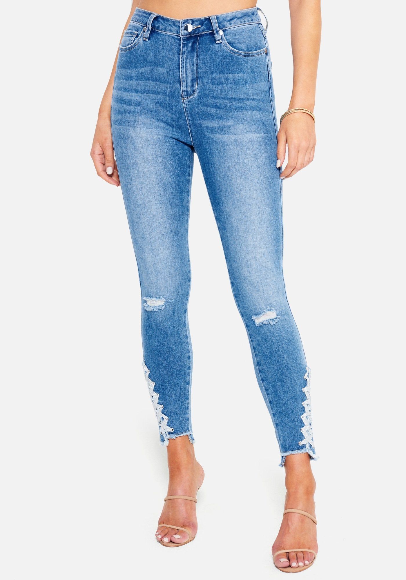 Ankle Lace Up Detail Skinny Jeans sold by Bebe